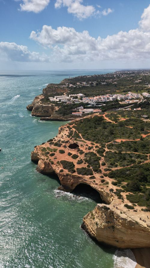 Free Aerial view of the dramatic Algarve coastline with cliffs, beaches, and ocean. Stock Photo