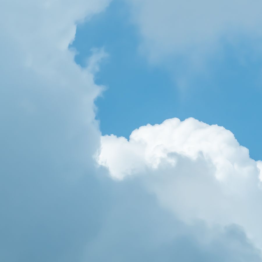 Soft blue sky with a bank of white cloud — photo by The Daphne Lens on Pexels