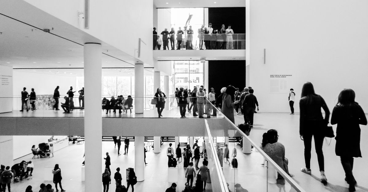 Beautiful art museum with classical architecture and visitors exploring cultural exhibits