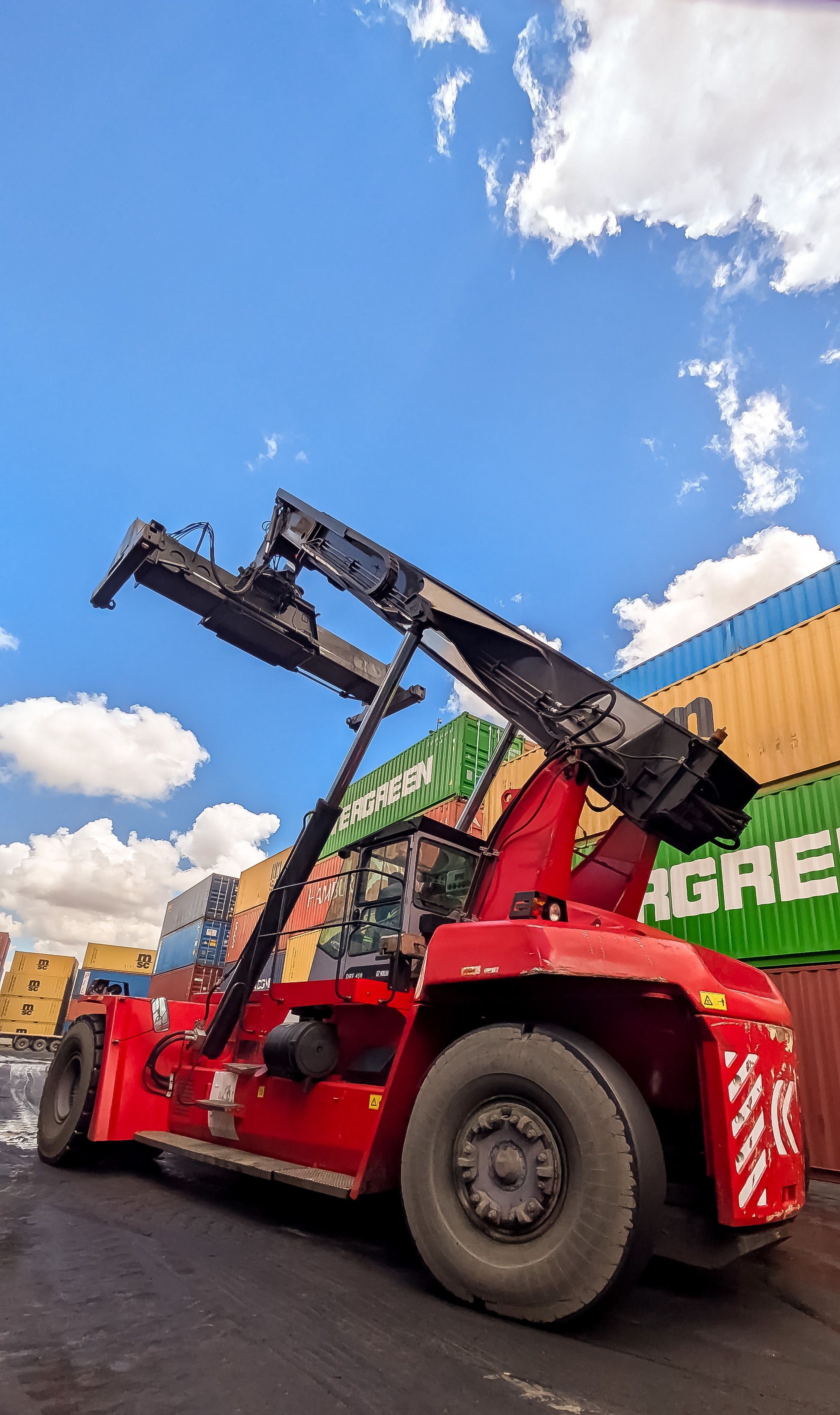 Industrial Crane Lifting Shipping Containers at Port · Free Stock Photo