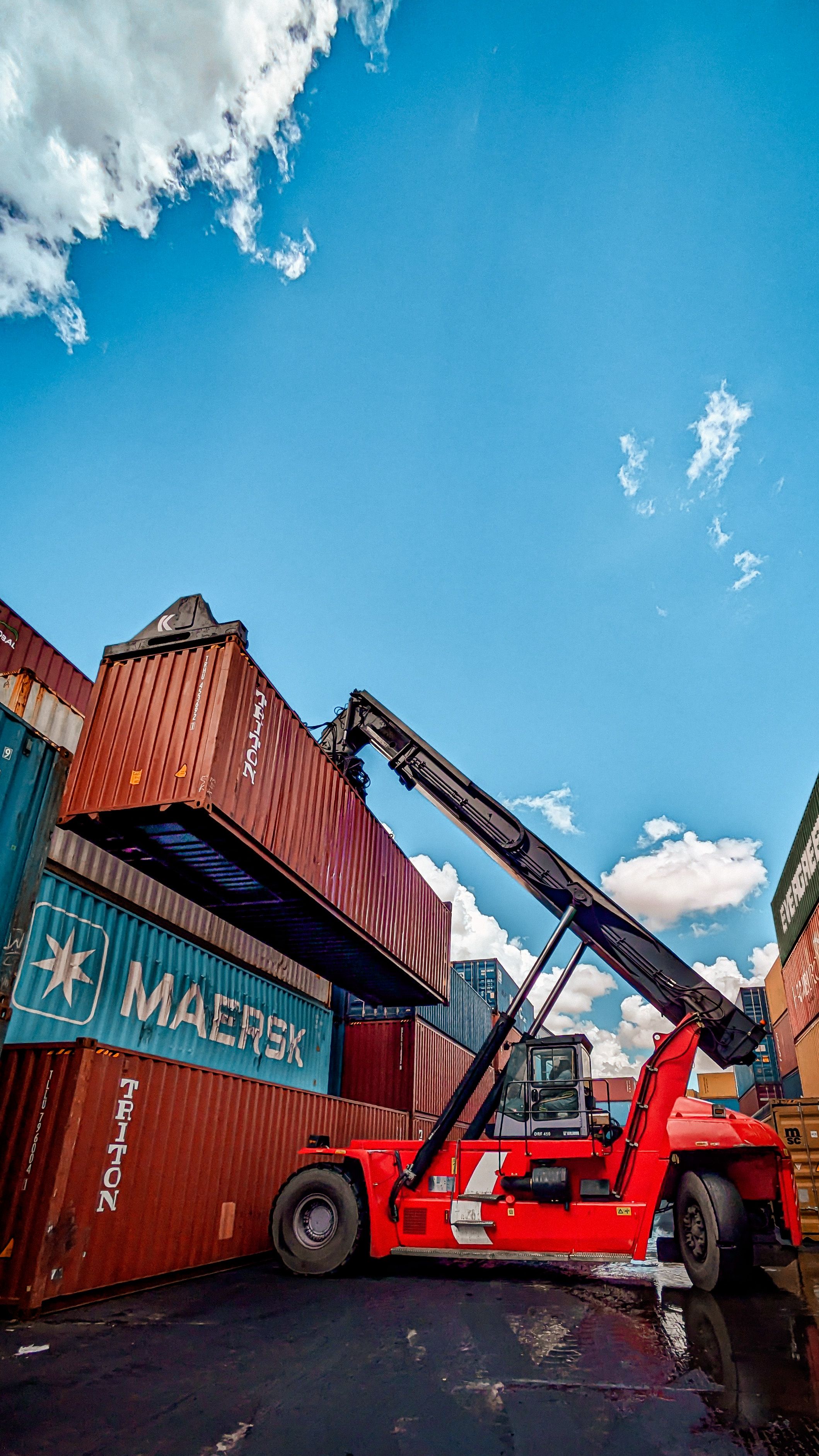 Industrial Crane Lifting Shipping Containers at Port · Free Stock Photo