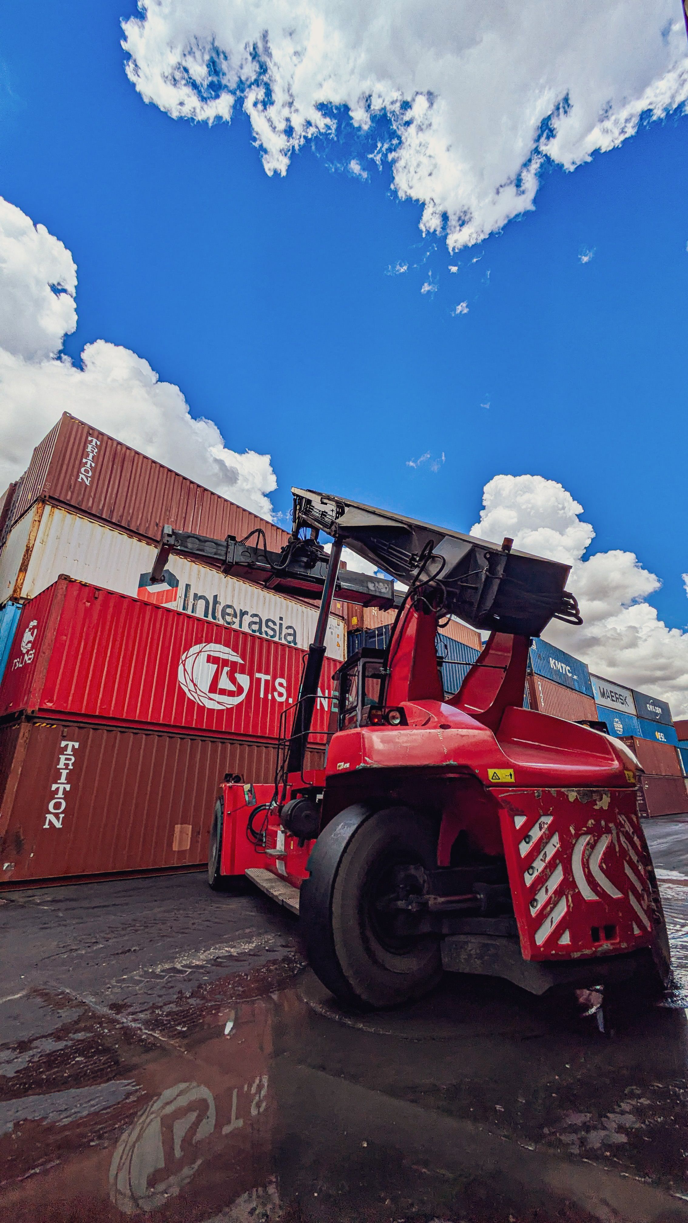 Industrial Crane Lifting Shipping Containers at Port · Free Stock Photo