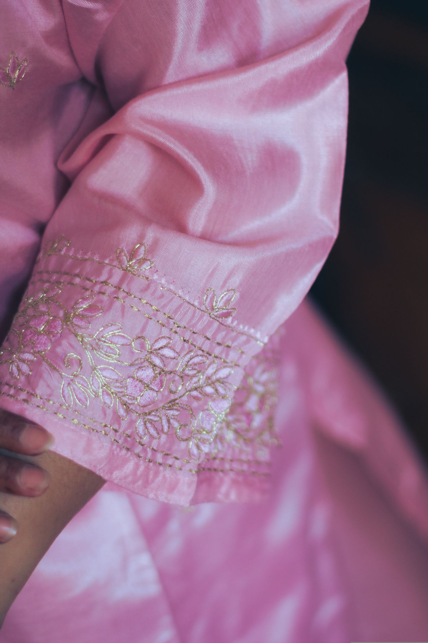 Close detail of a pink embroidered garment
