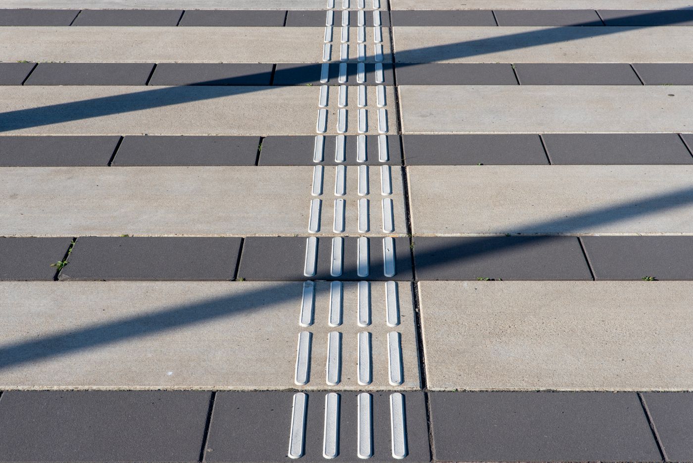 Tactile paving installed along an urban pedestrian path