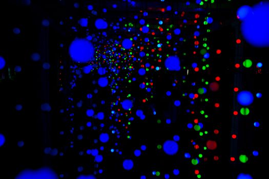 Colorful LED lights creating abstract patterns against a dark background.