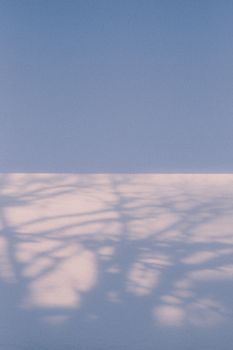 Captivating winter scene in Sweden with shadows cast on pristine snow and clear sky.