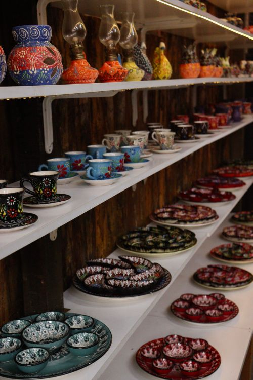 Free Vibrant handcrafted ceramic pots, cups, and plates on display, showcasing traditional design and artistry. Stock Photo