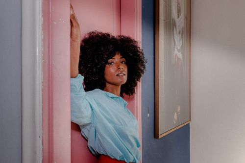 Free Stylish woman in colorful indoor setting with artistic decor in São Paulo, Brazil. Stock Photo