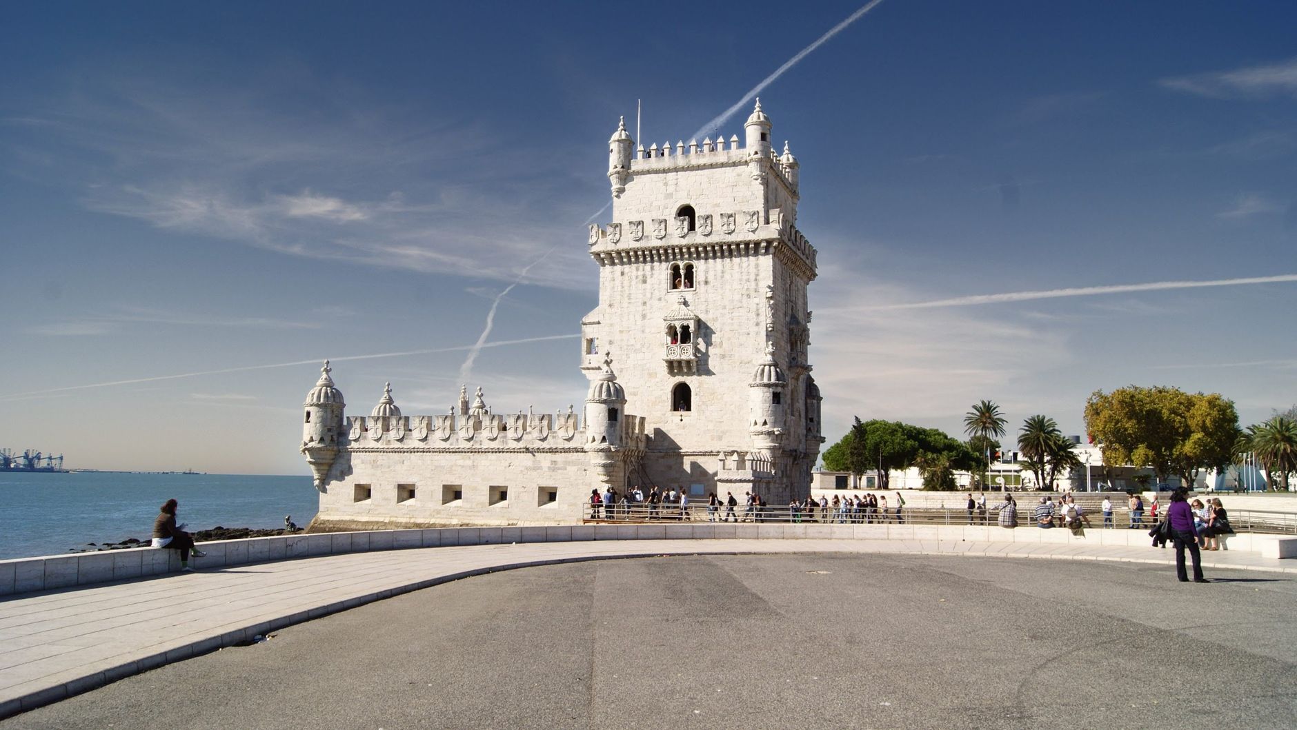 Iconic Belem Tower in Lisbon with blue skies, showcasing Portuguese architecture.