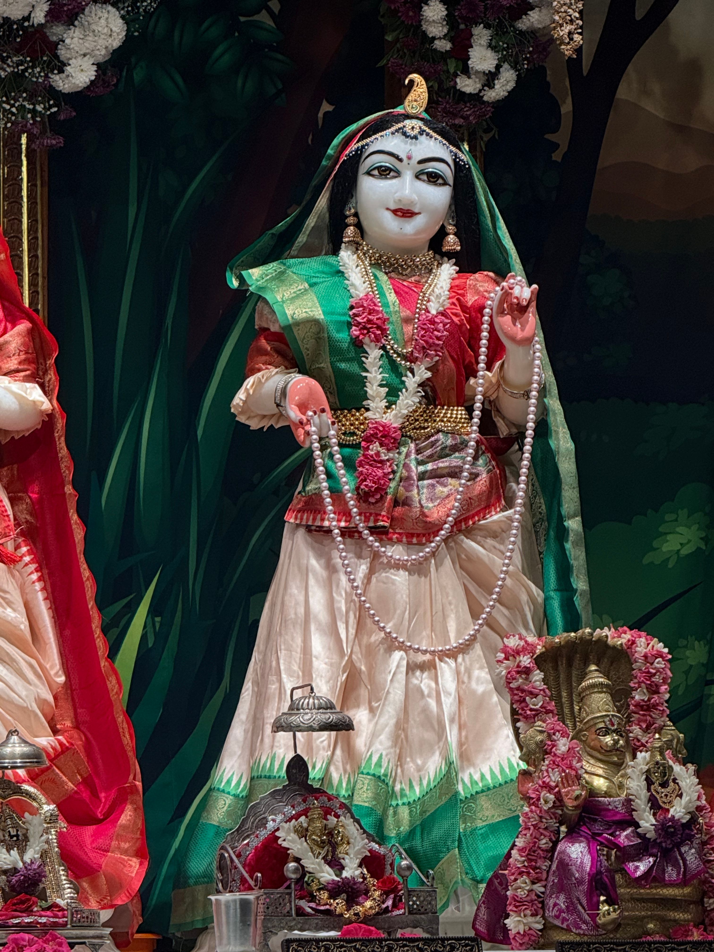 Exquisite statue of a traditional Indian deity beautifully adorned within a temple in Tirupati.