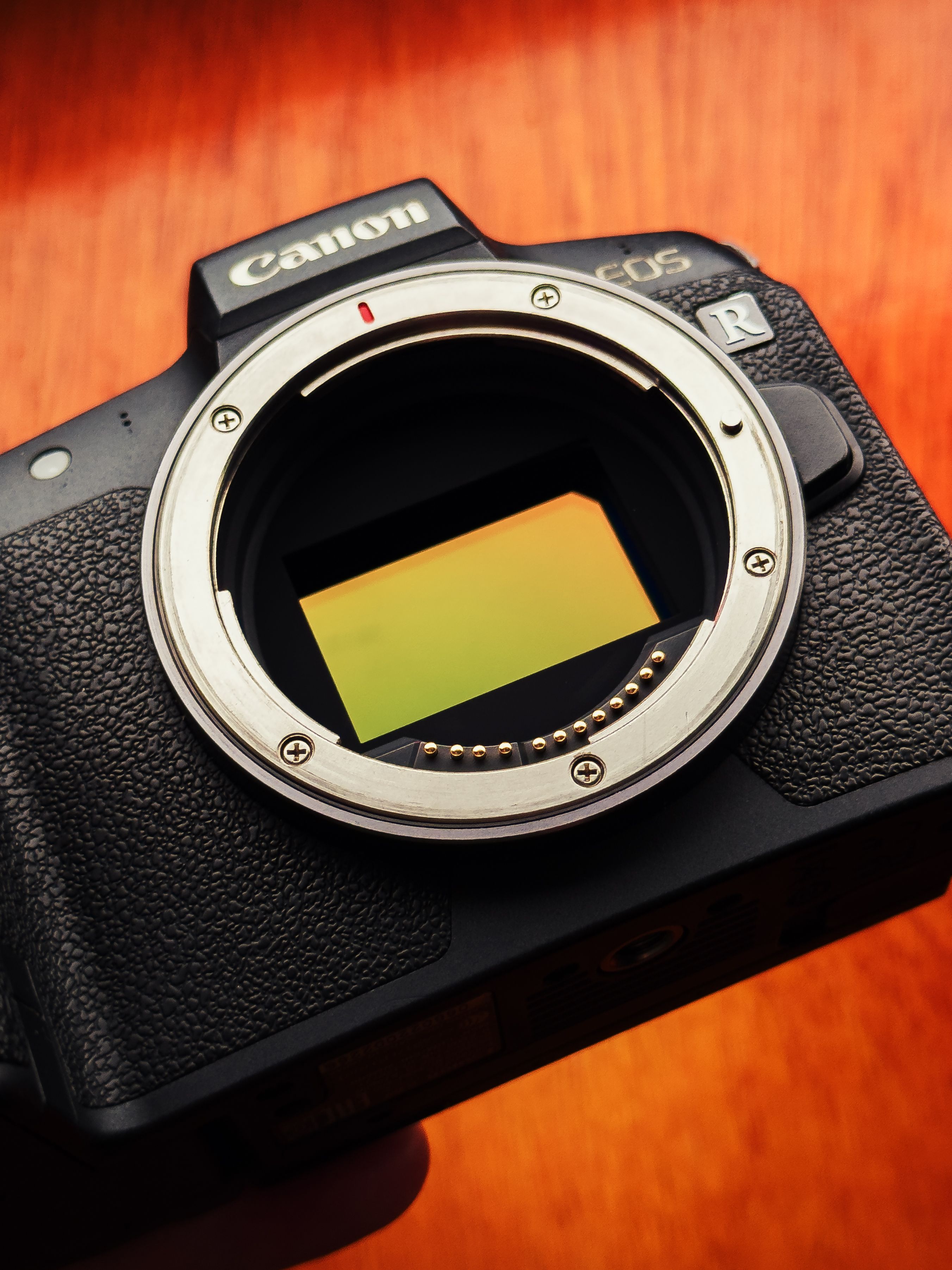 Close-up of Camera Sensor on Wooden Surface · Free Stock Photo