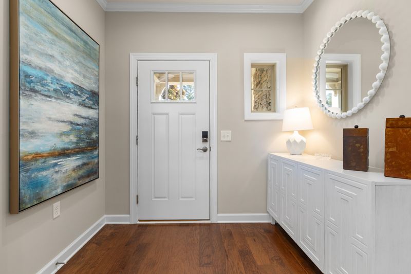 Welcoming Miami entry foyer with balanced circulation and tailored storage