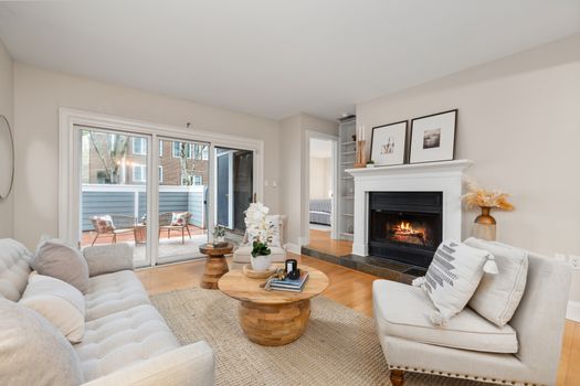 Elegant living room featuring a modern fireplace and outdoor access.