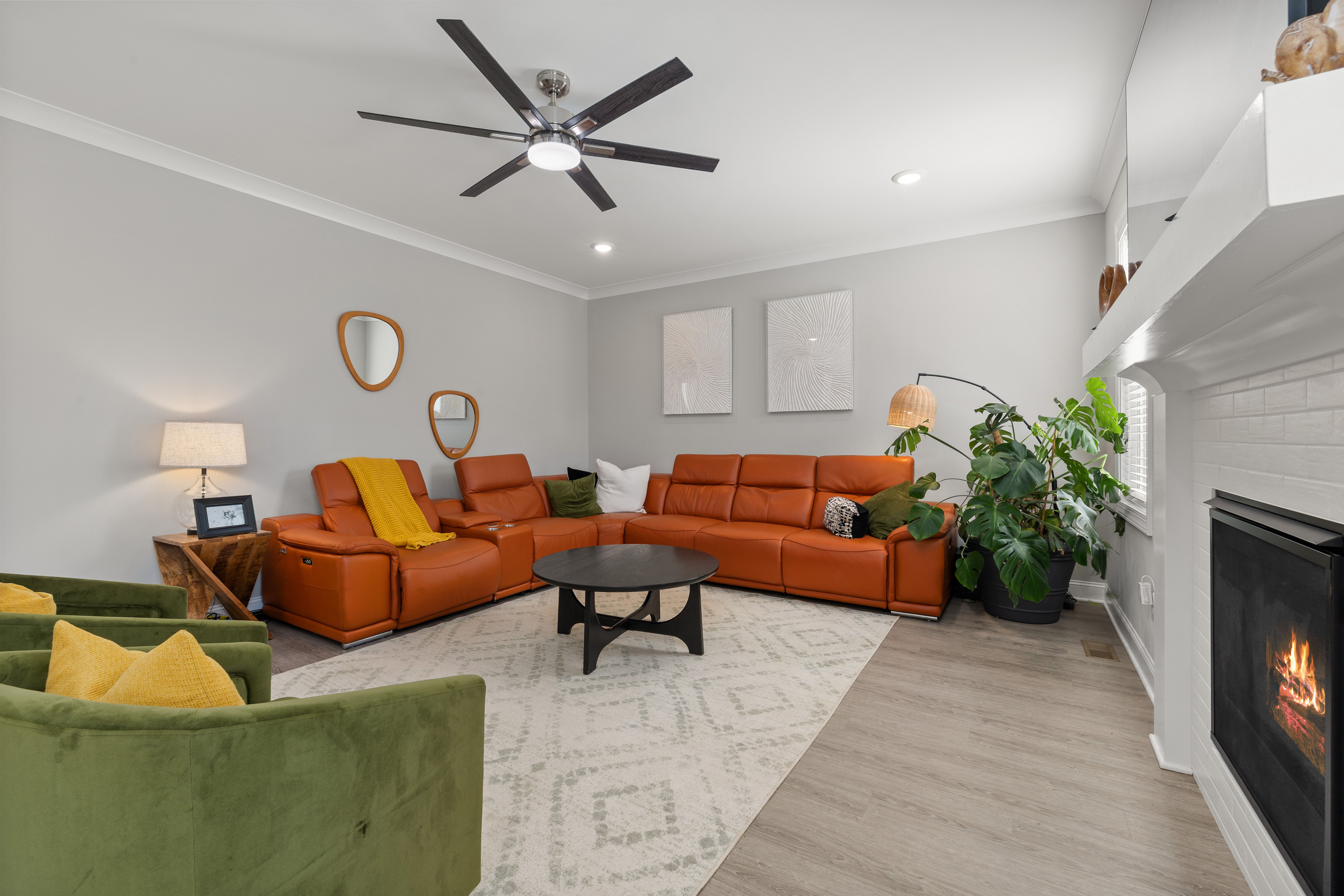 Modern Living Room with Orange Sofa and Greenery · Free Stock Photo