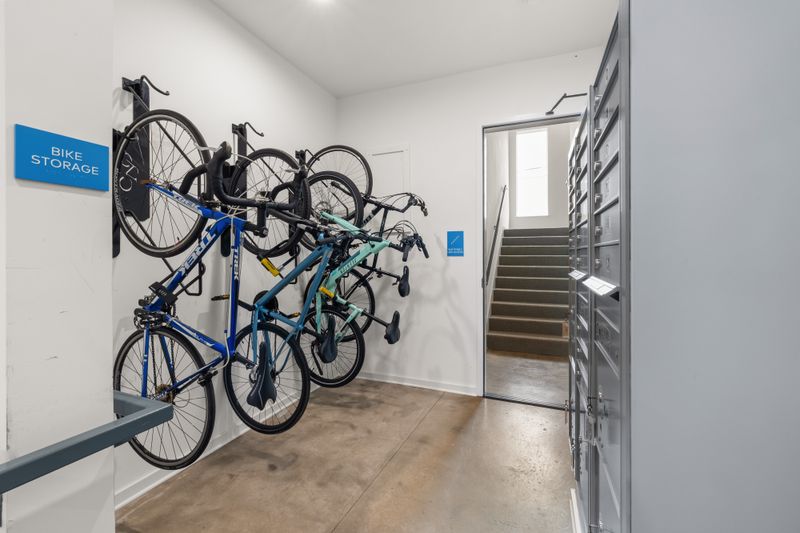 Modern indoor bike storage area with multiple bikes securely mounted on wall racks