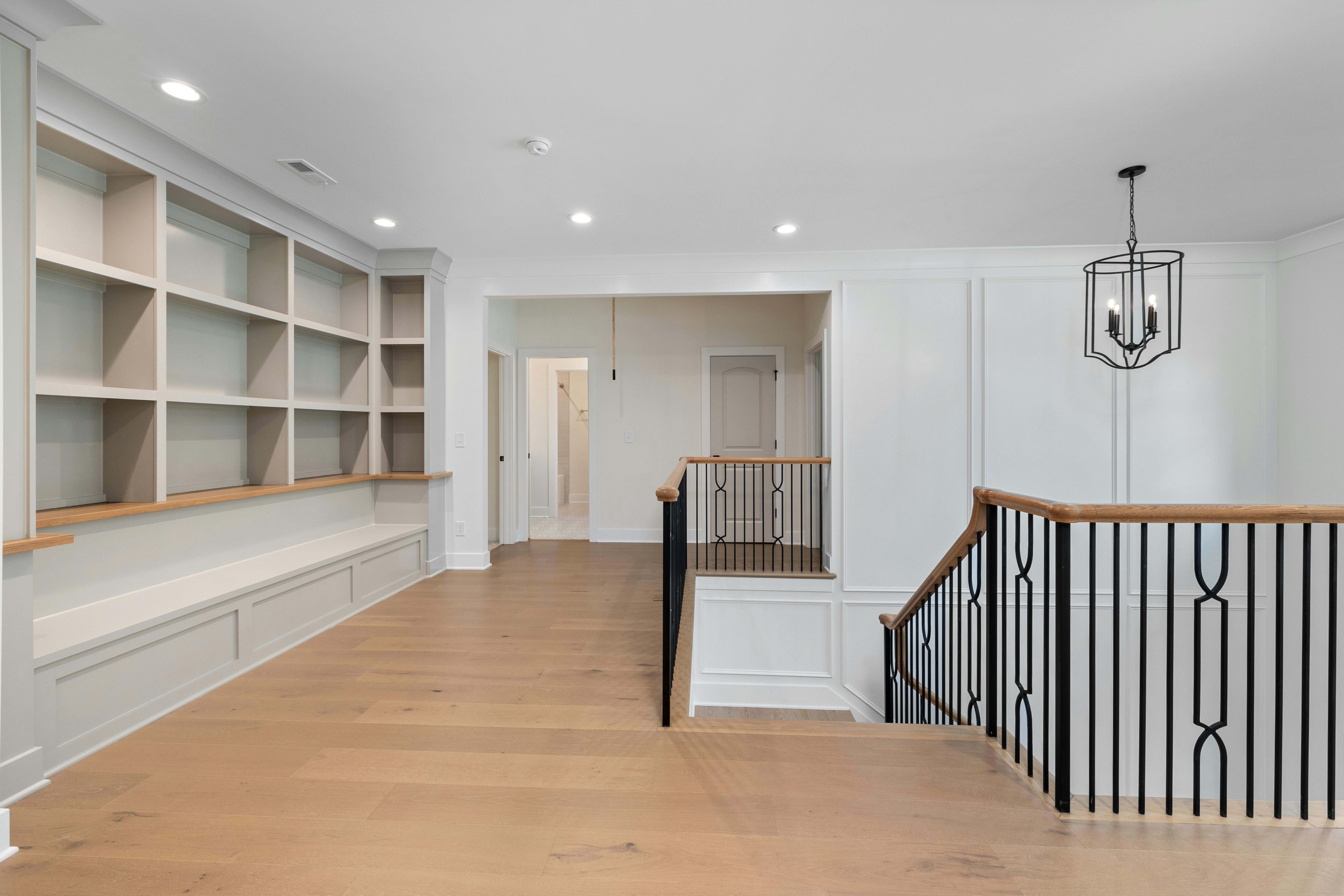 Grand foyer with a sweeping American hardwood staircase and polished oak floors - Home & Design -- pillar: Hardwood in Home