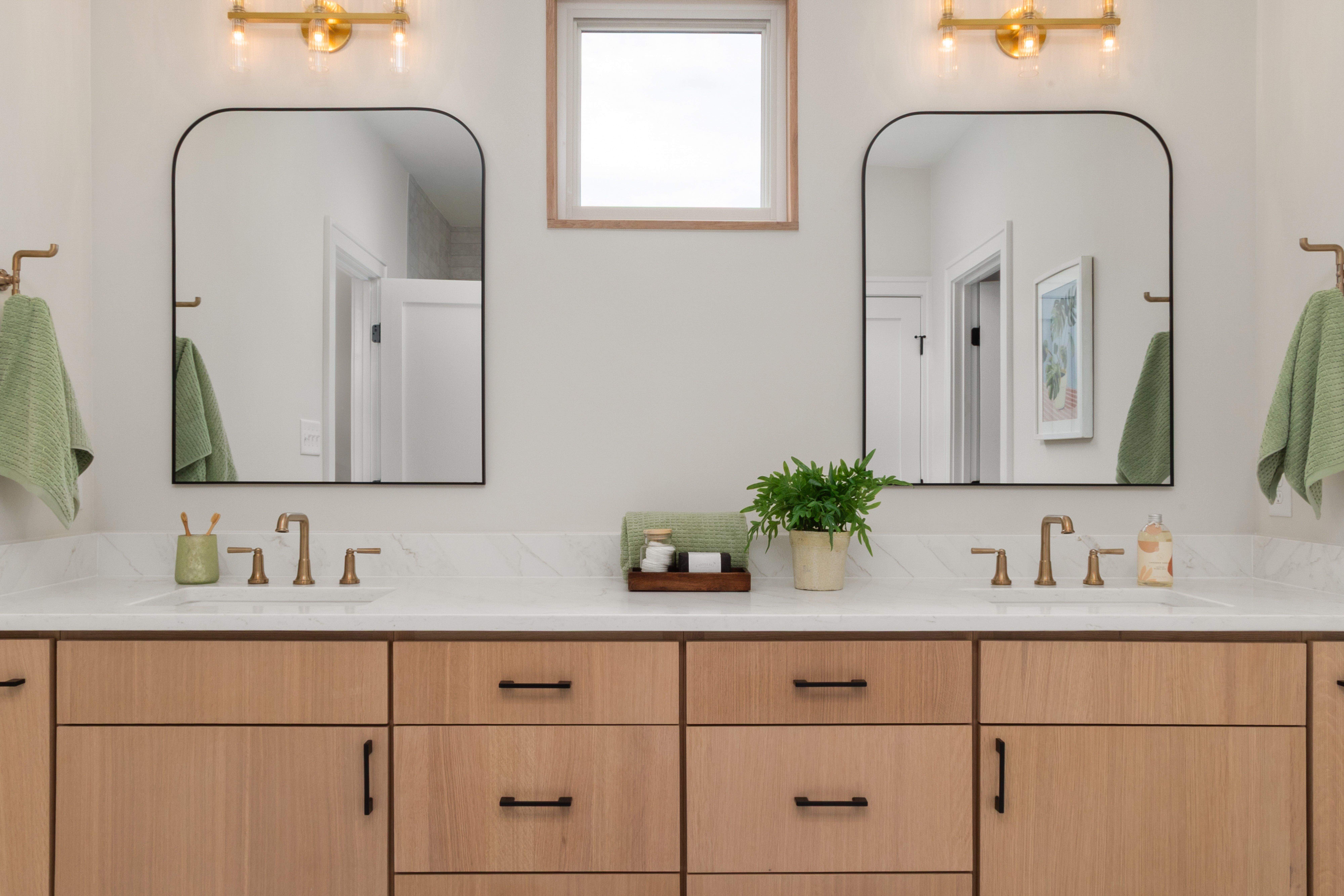 Modern bathroom design inspiration board featuring sleek fixtures and contemporary color schemes for Indianapolis remode