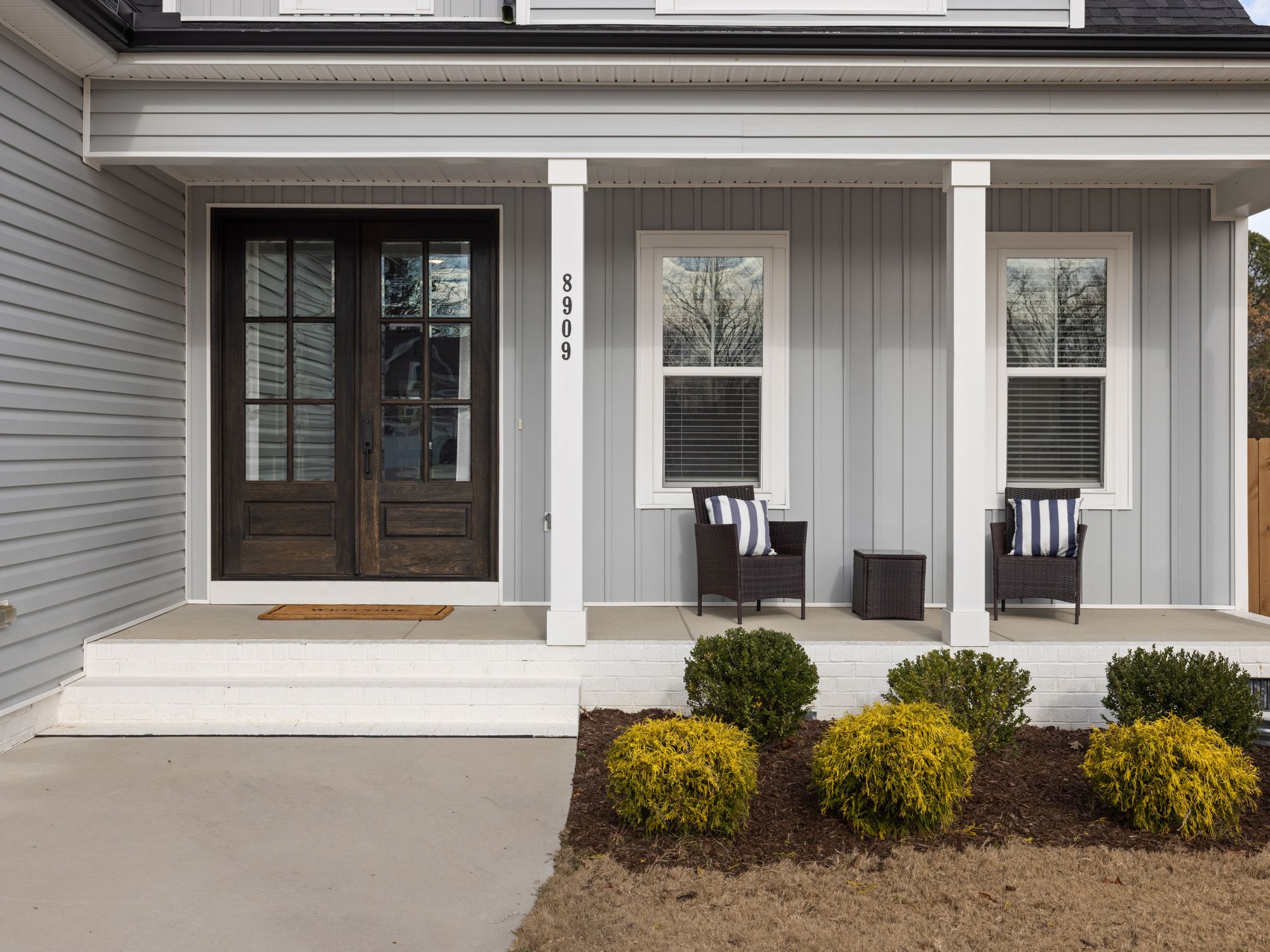 Exterior Painting in Lambeth, Lambeth — painter refreshing a house exterior in weatherproof paint