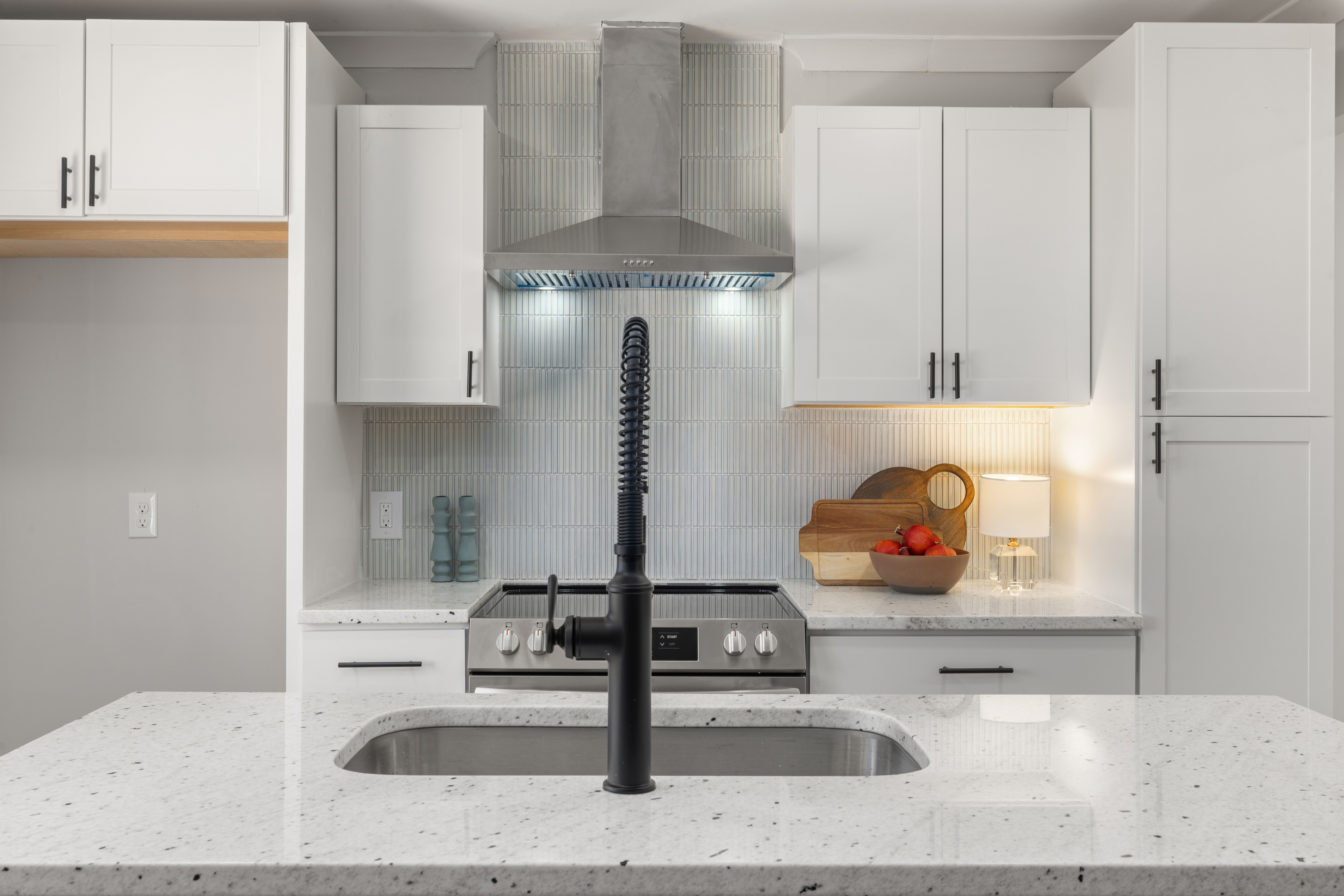 Contemporary kitchen featuring marble countertops and stylish cabinetry for a sophisticated look.
