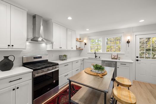 Bright contemporary kitchen with stainless steel appliances and a central island.