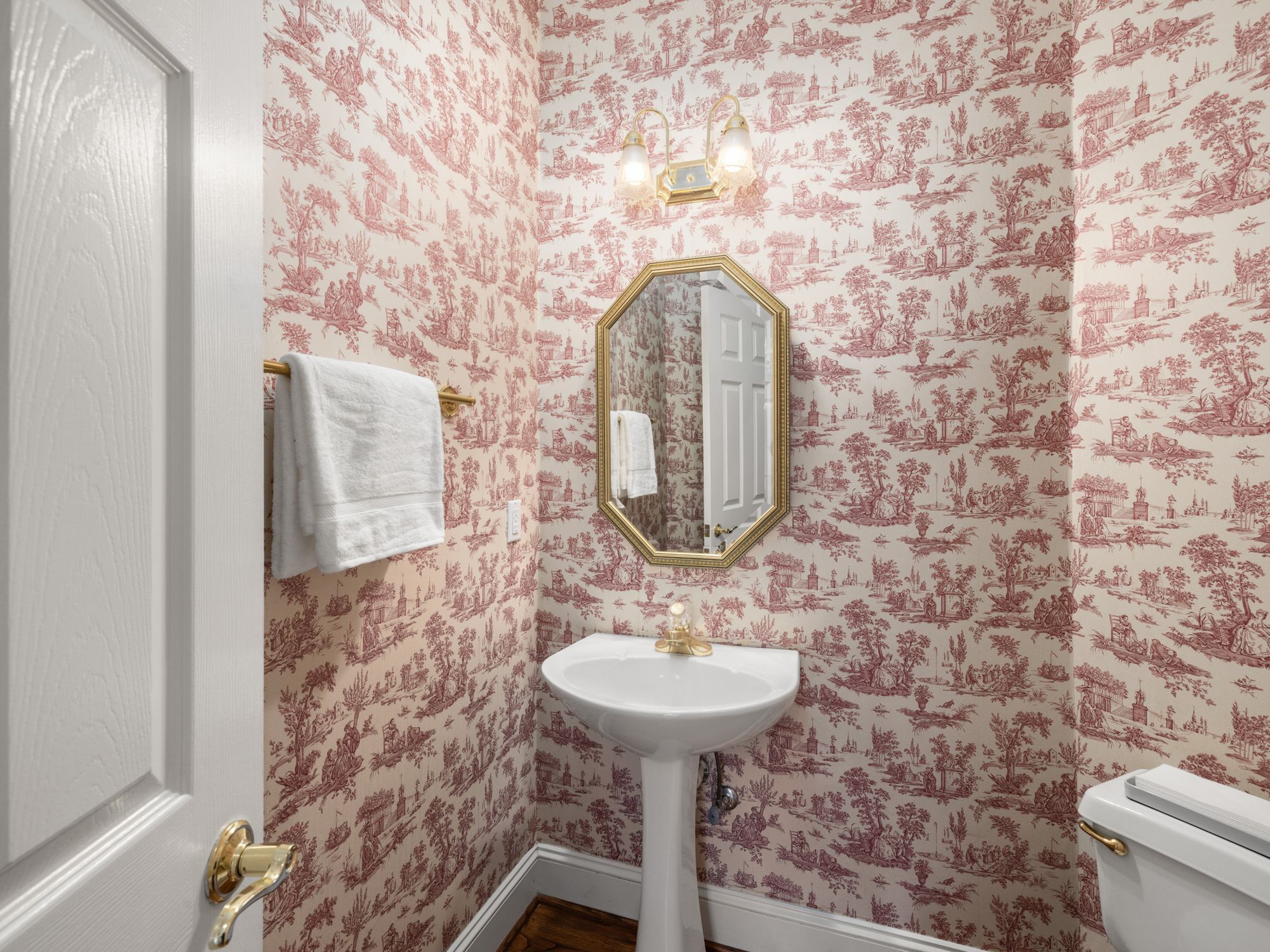 Wallpapering in Brompton, Kensington and Chelsea — decorator hanging pattern-matched wallpaper