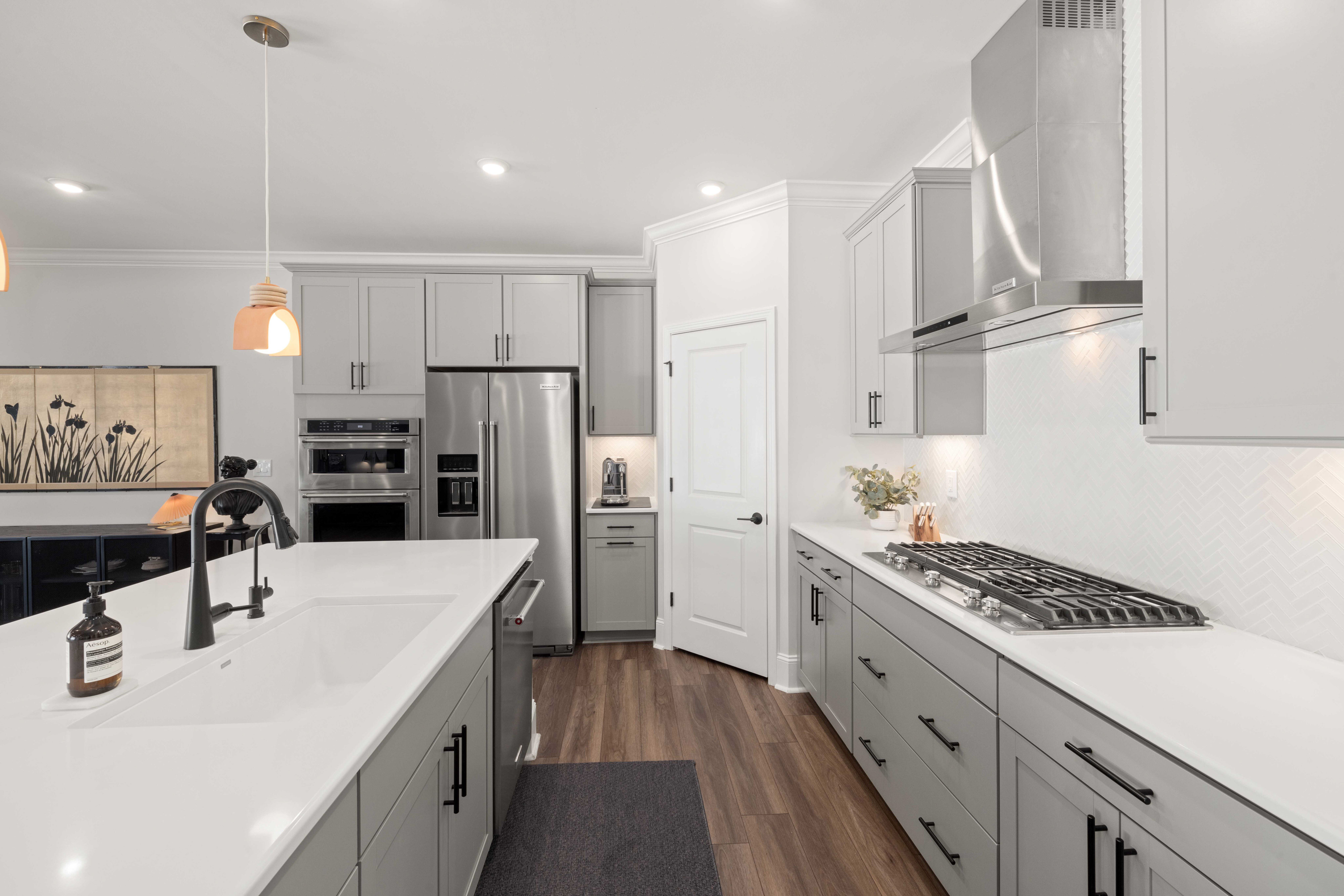 Kitchen Spraying in Surrey Quays — careful masking before painting begins