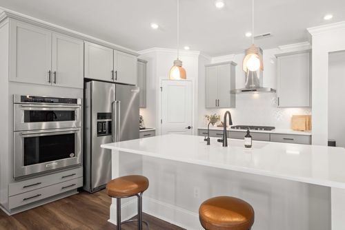 Free Bright and inviting kitchen with modern appliances and minimalist design. Stock Photo