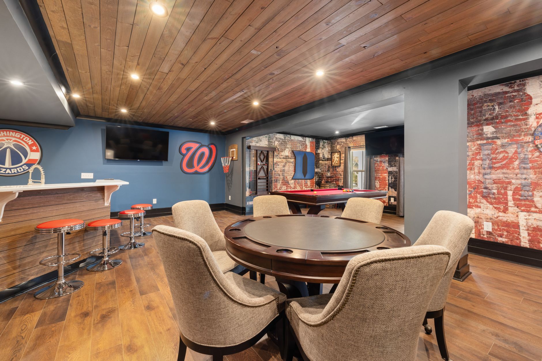 Modern basement game room with bar, seating, and pool table for spring addition contractor projects in Guelph. Modern basement game room with bar, seating, and pool table for spring addition contractor projects in Guelph.