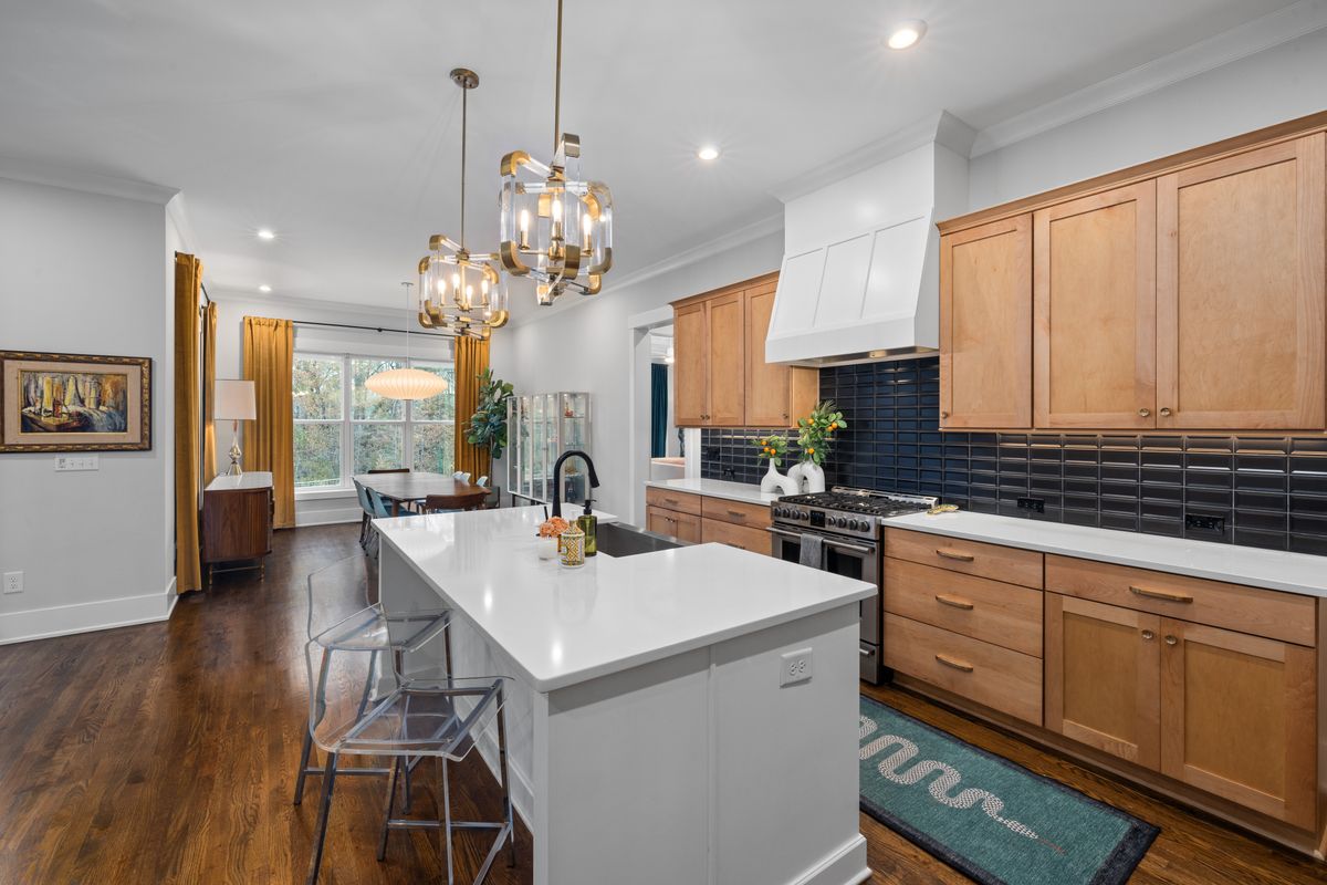 Large modern kitchen with island and dining area