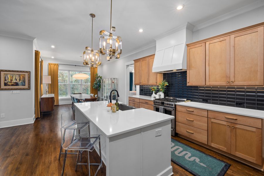 Spacious kitchen with wooden cabinets and island