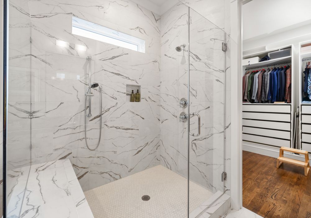 Custom tile shower remodel with frameless glass in Downtown Riverside