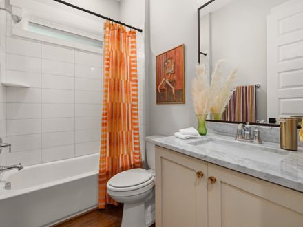 Shower curtain rod mounted over a tub