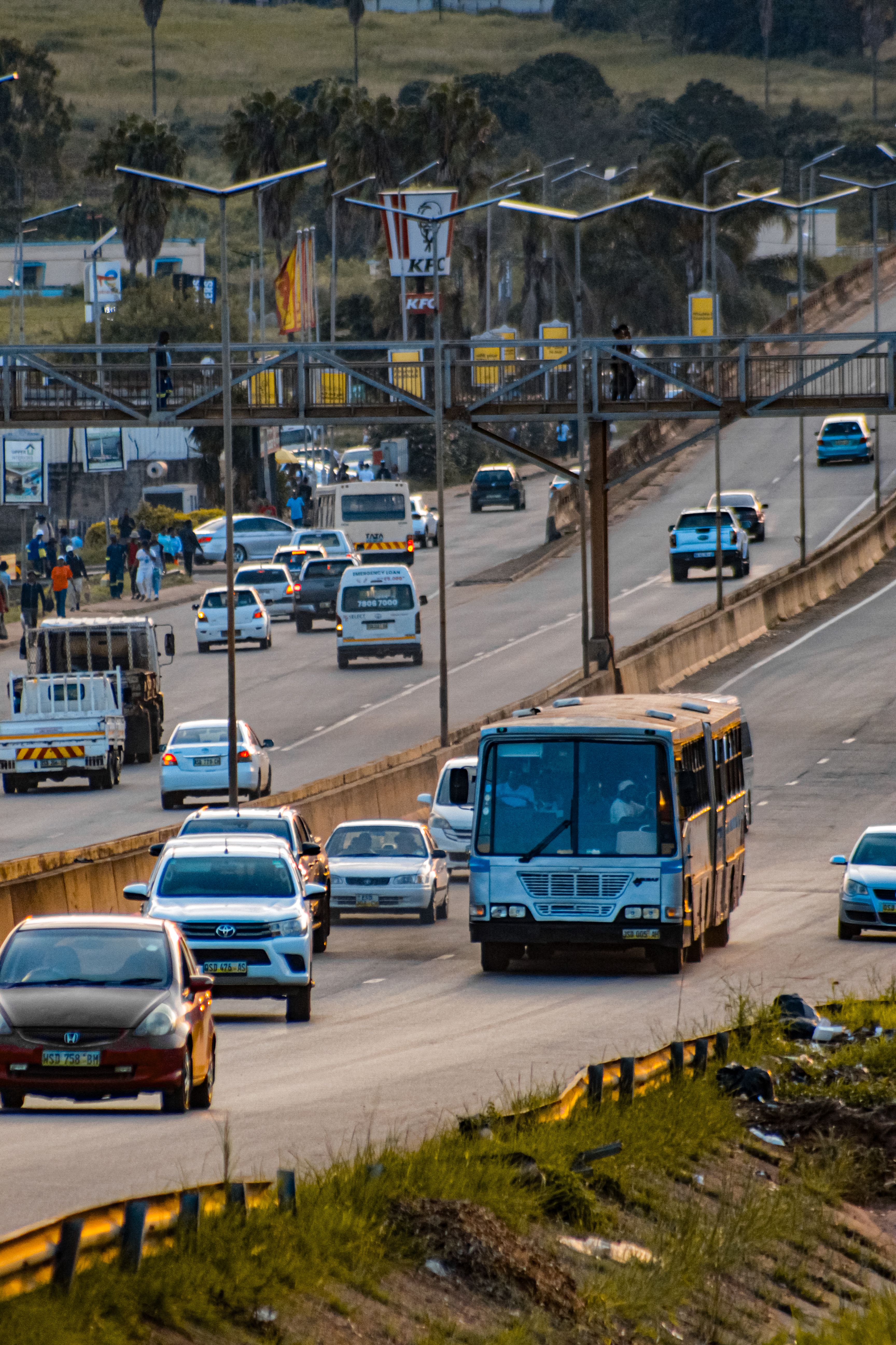 A busy highway in Matsapha, Eswatini, showcasing heavy traffic under a bright sky.