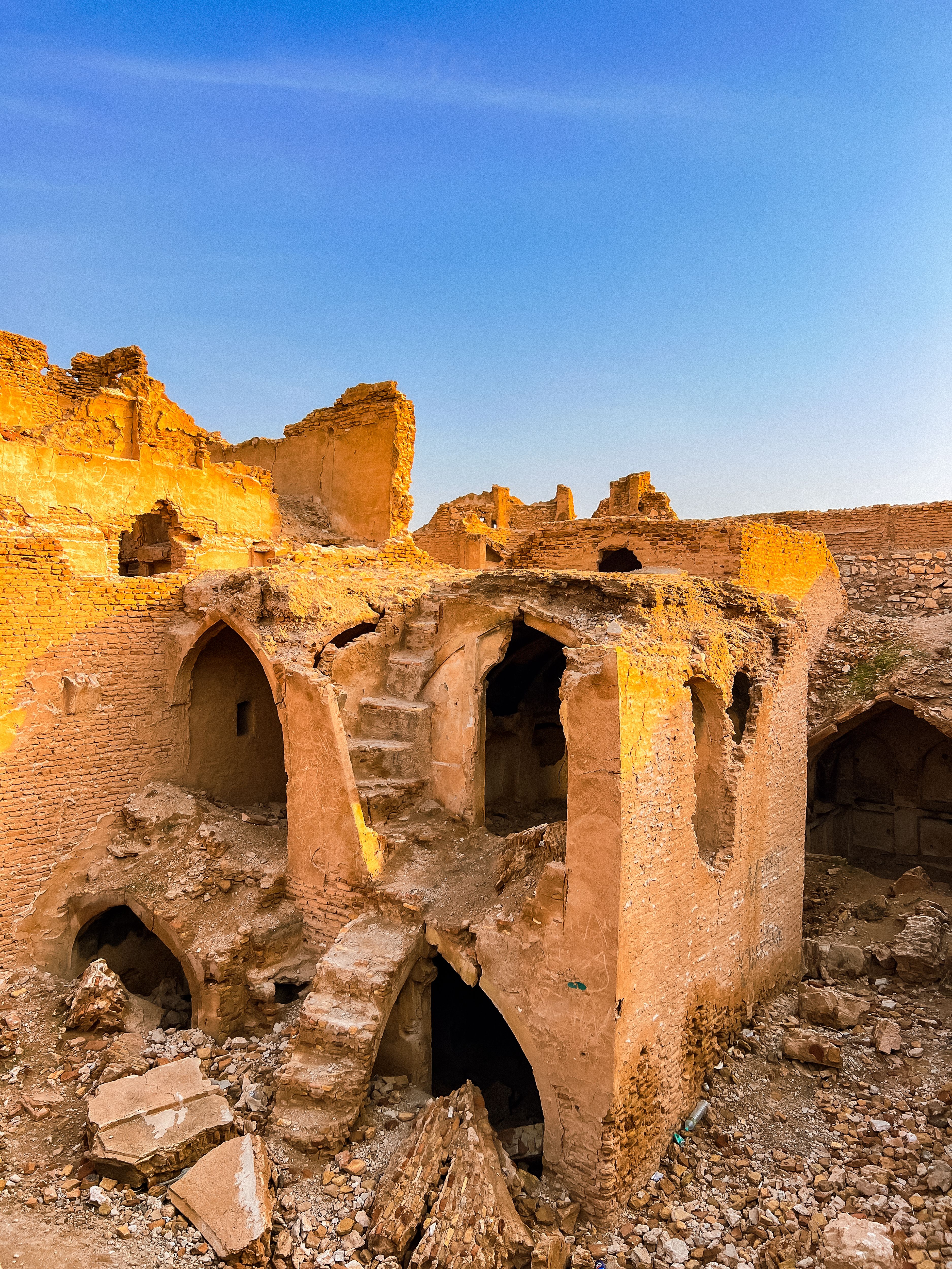 Explore the historic Mesopotamian ruins at sunset, showcasing ancient architecture and desert hues.