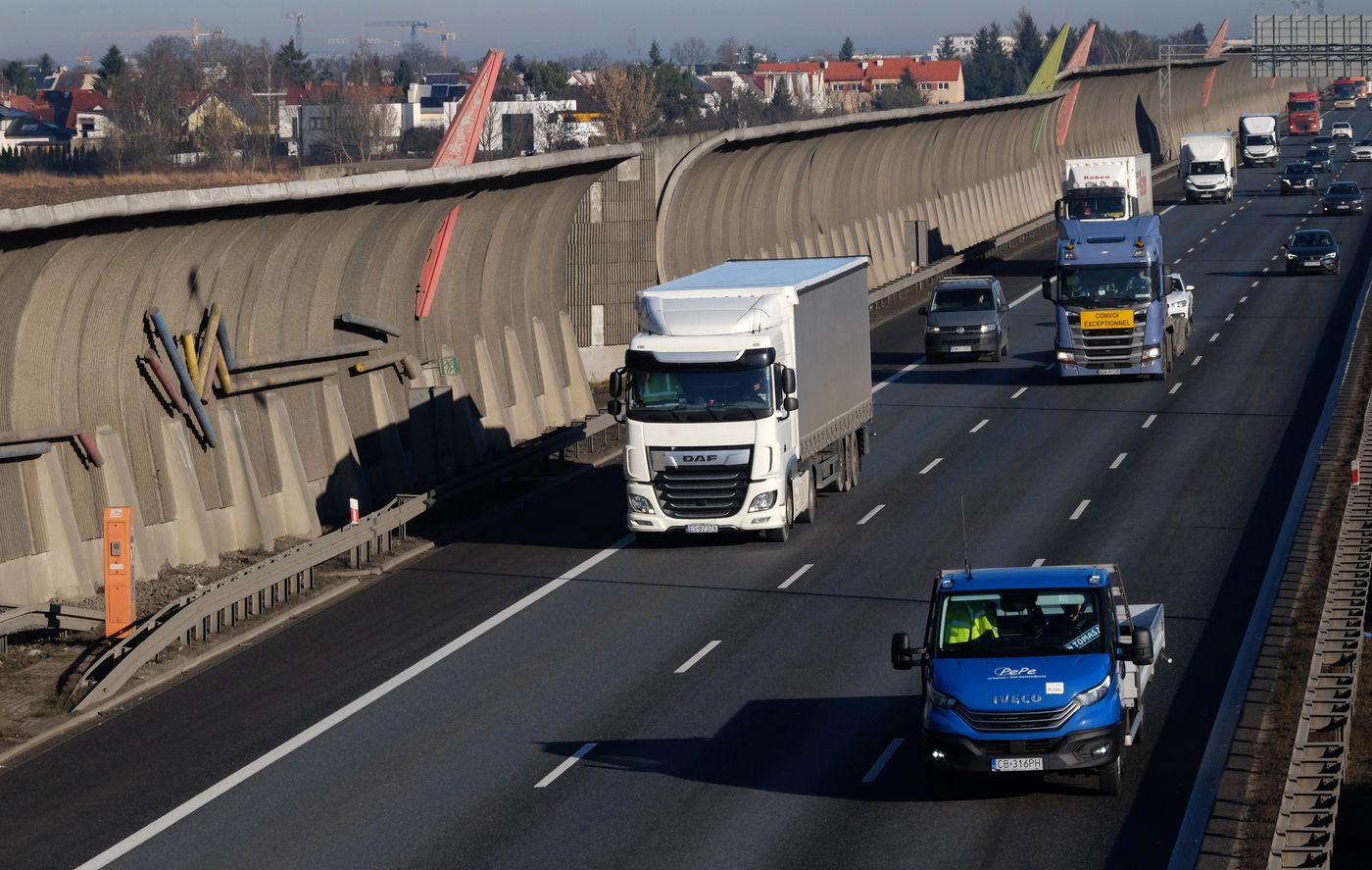 Freight trucks moving on a major highway corridor