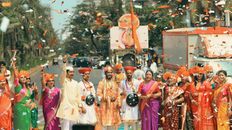 A lively Gudi Padwa festival parade with traditional Marathi attire on a Mumbai street.