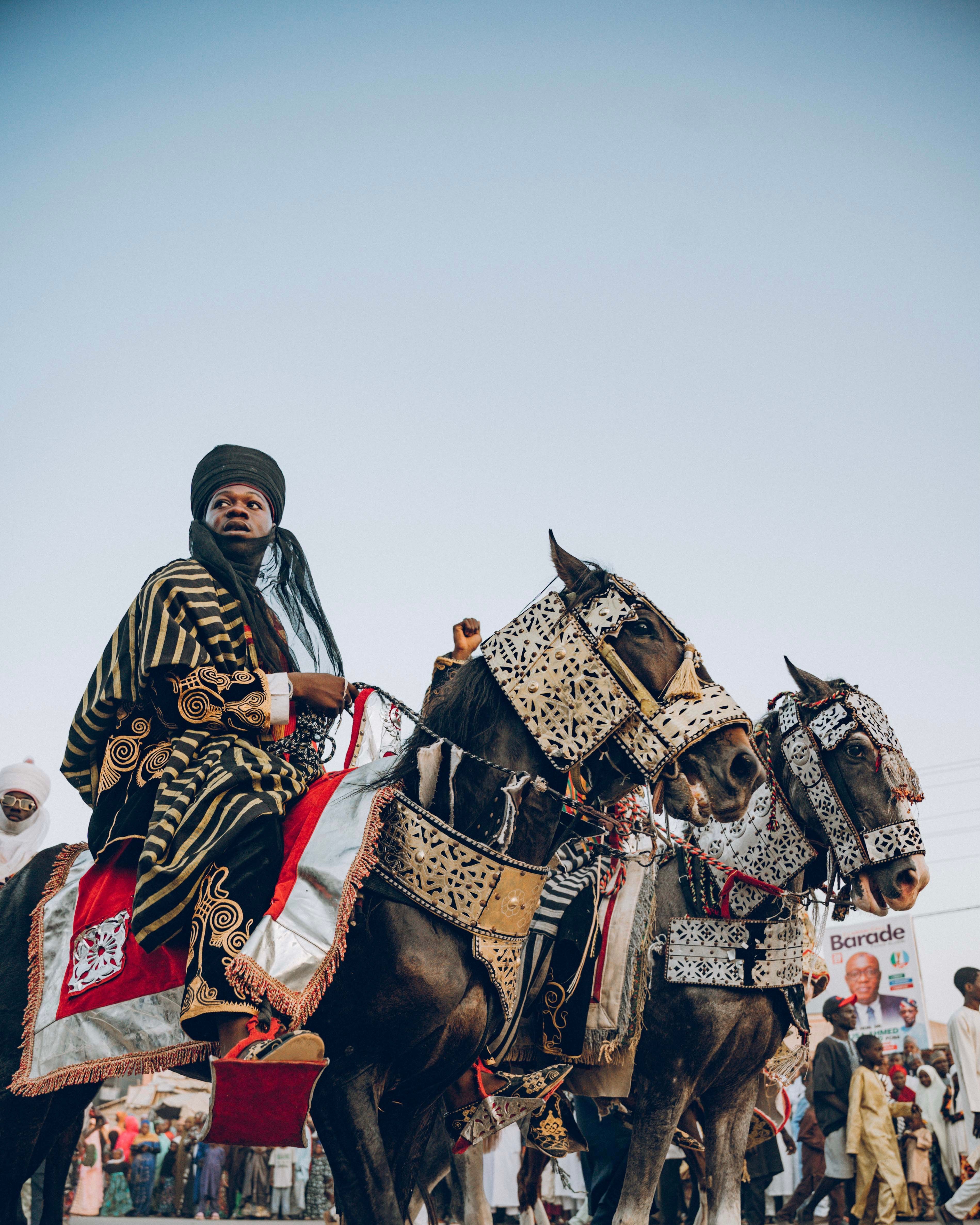 Vibrant image of traditional horse riders in cultural parade attire.