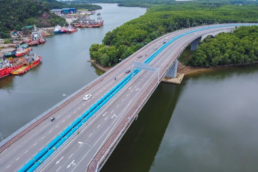 Drone shot of a highway over a river in Chukai, Terengganu, Malaysia.