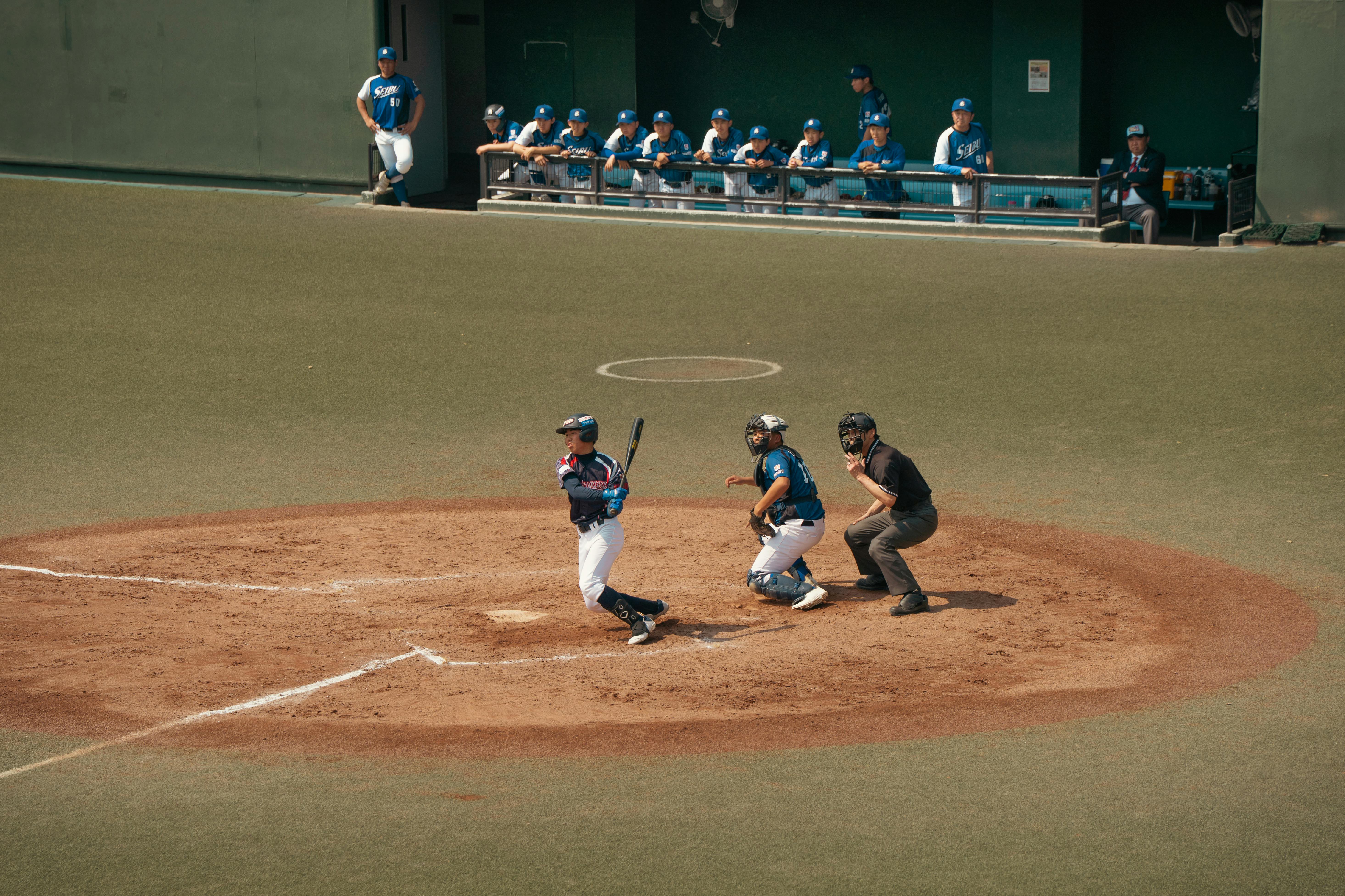 Dynamic scene of a baseball game in a Tokyo stadium capturing the batter's swing.