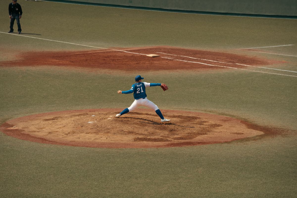 Athlete gripping and throwing a ball