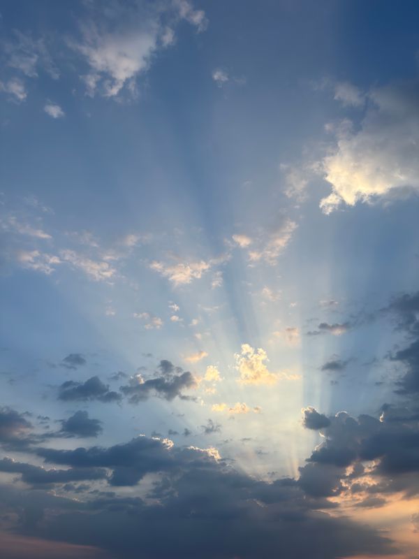 Majestic Sunbeams Breaking Through Clouds · Free Stock Photo