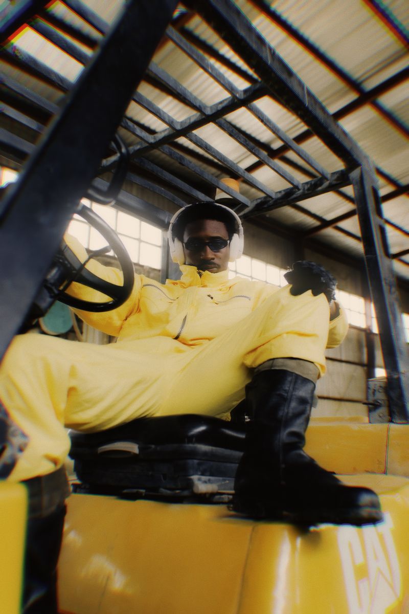 Nigerian industrial worker in yellow protective gear
