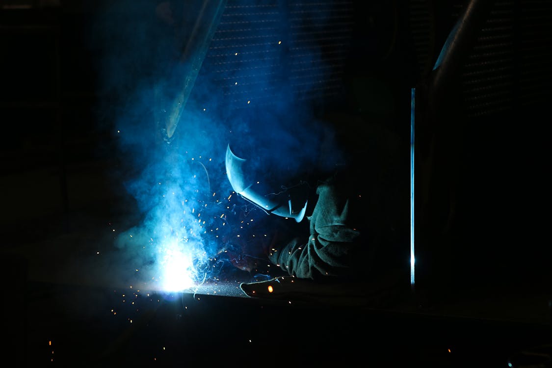 Free Man Using a Electric Welding Stock Photo
