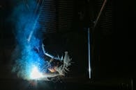Man Wearing Brown Glove and A Mask