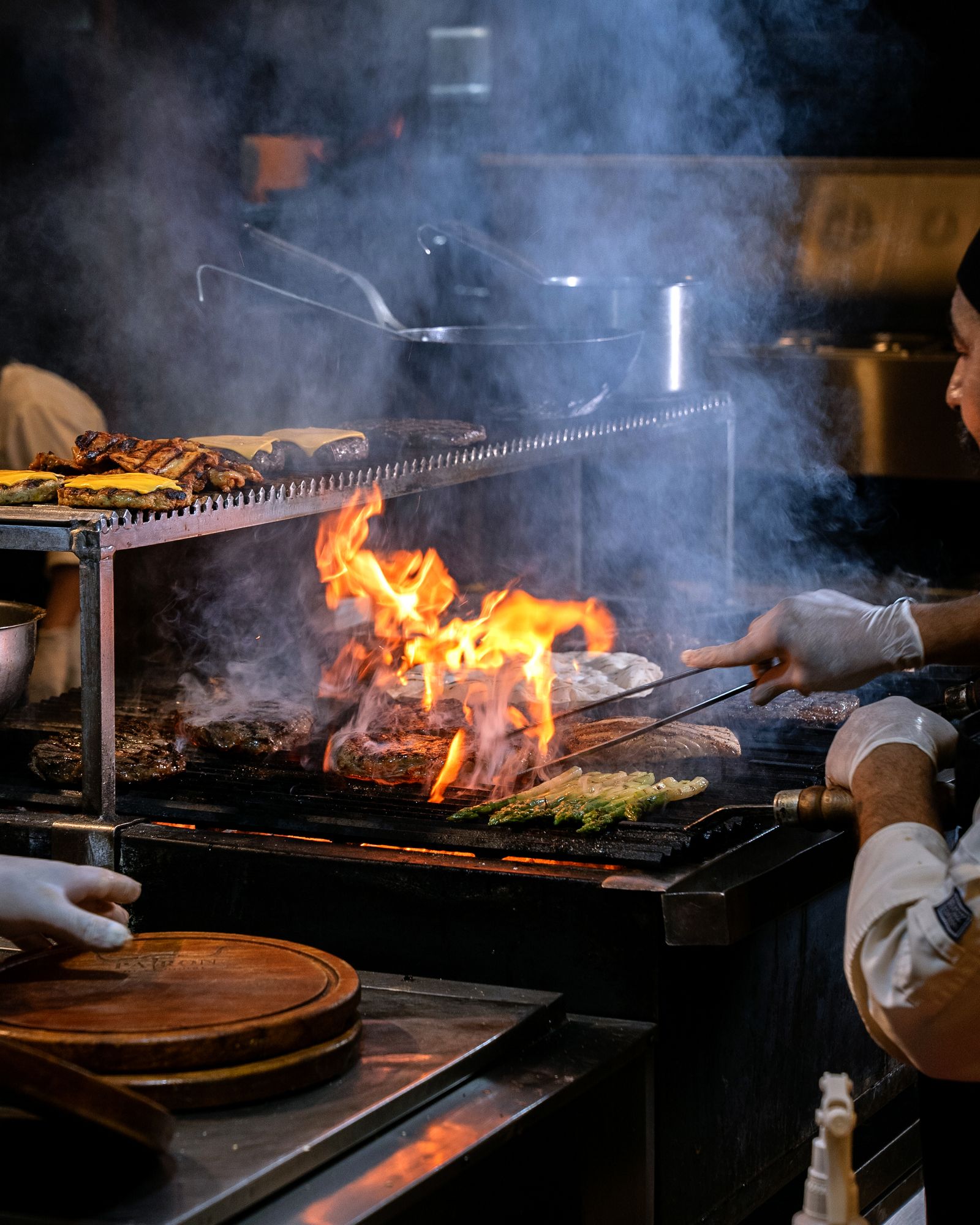 Chef Grilling Meat in a Professional Kitchen · Free Stock Photo