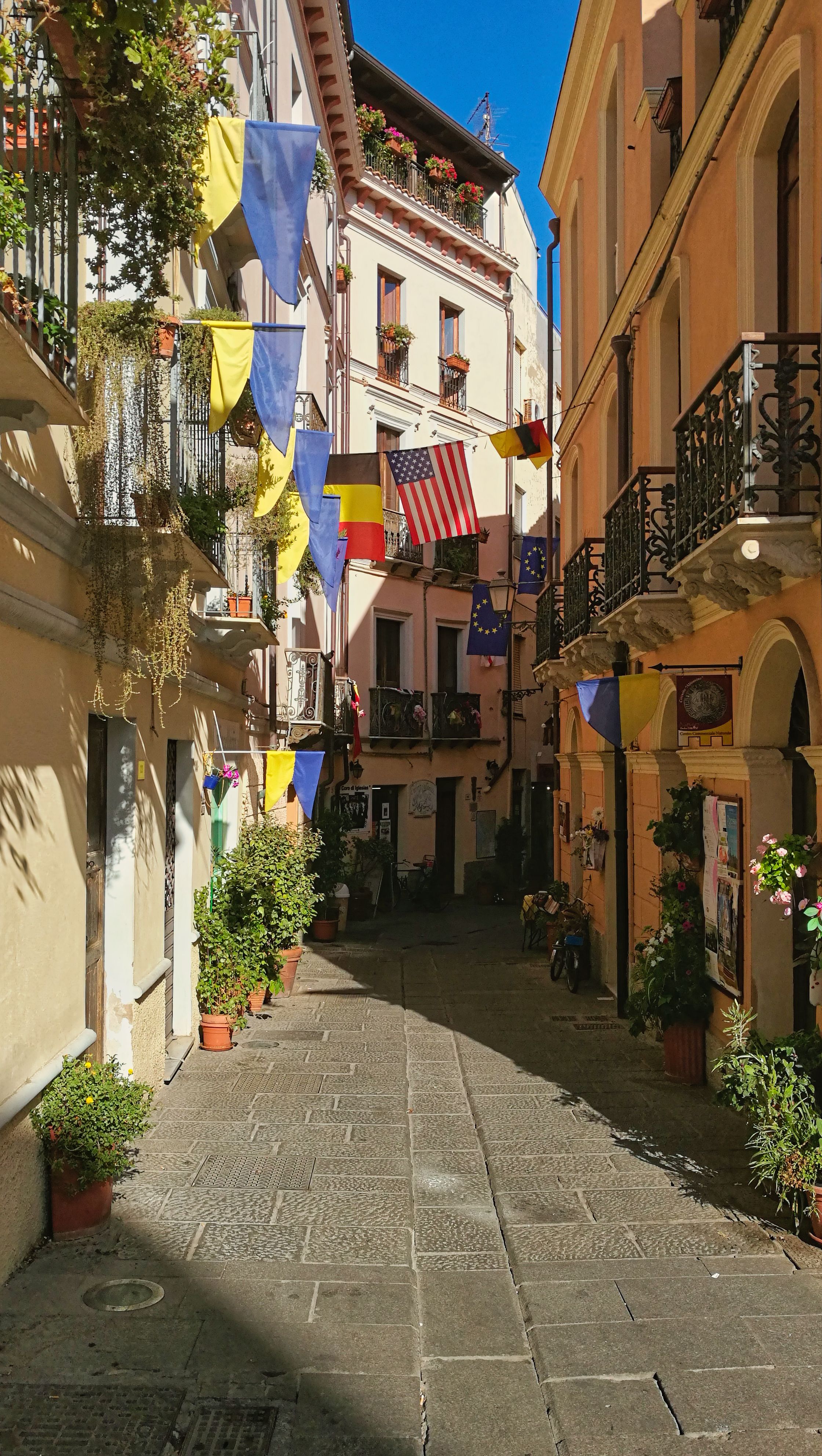 Colorful Alley with Flags in Iglesias, Sardinia · Free Stock Photo