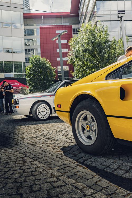 Free Vintage sports cars displayed at an outdoor exhibit, showcasing vibrant colors and sleek design. Stock Photo