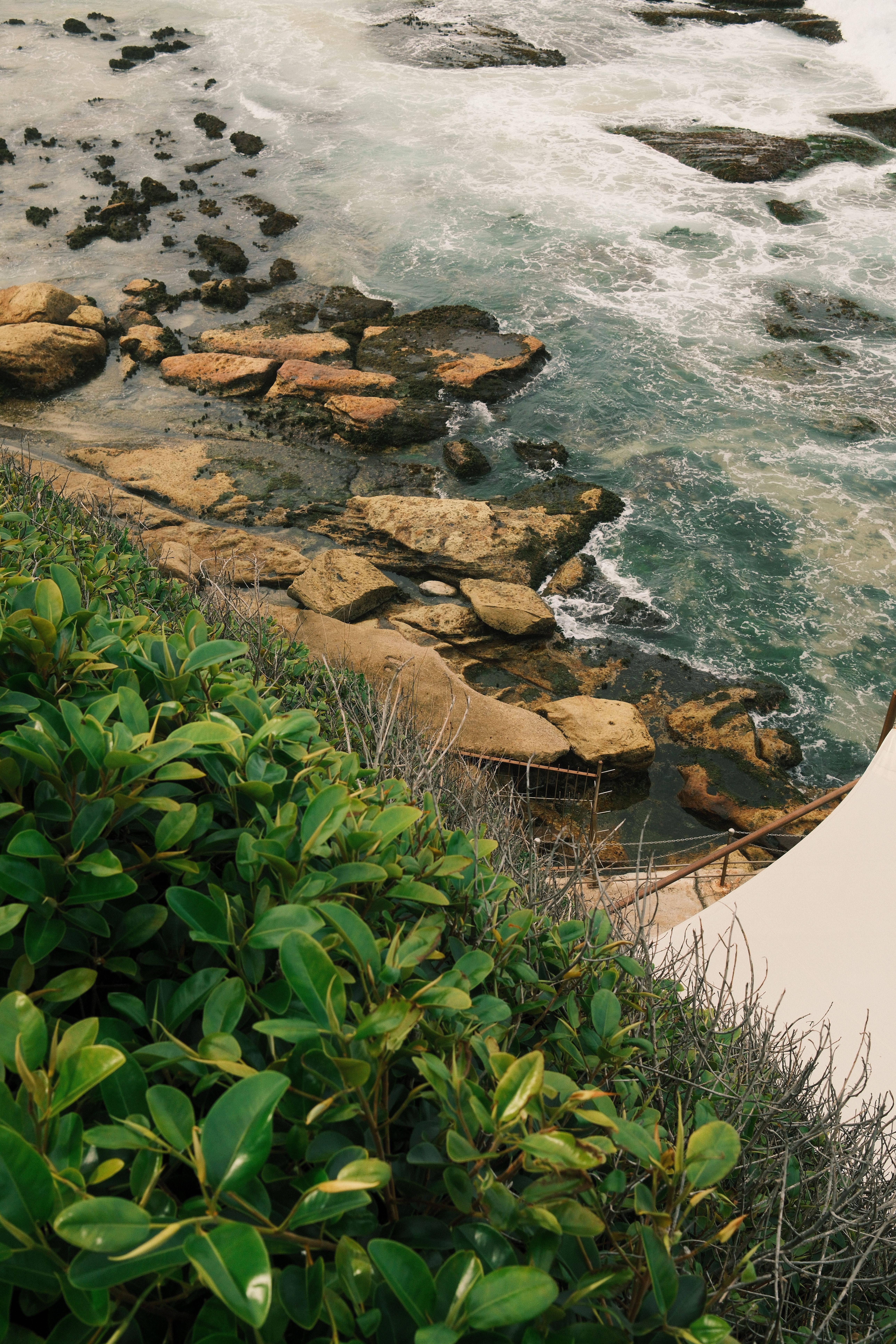 Scenic Coastal View with Rocks and Greenery · Free Stock Photo