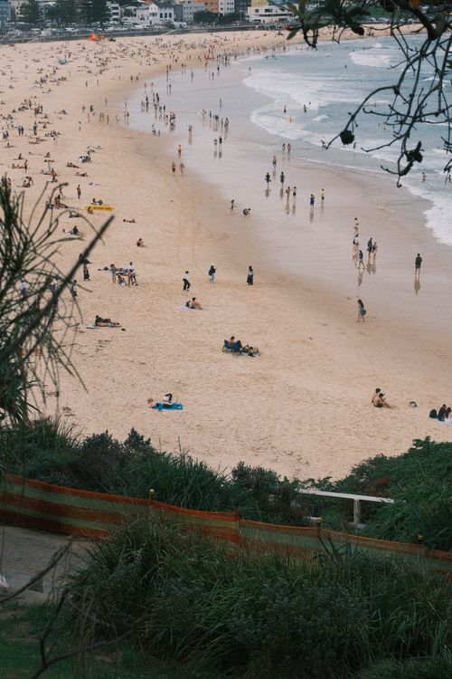 Free View of Bondi Beach, Sydney with people enjoying the seaside on a summer day. Stock Photo