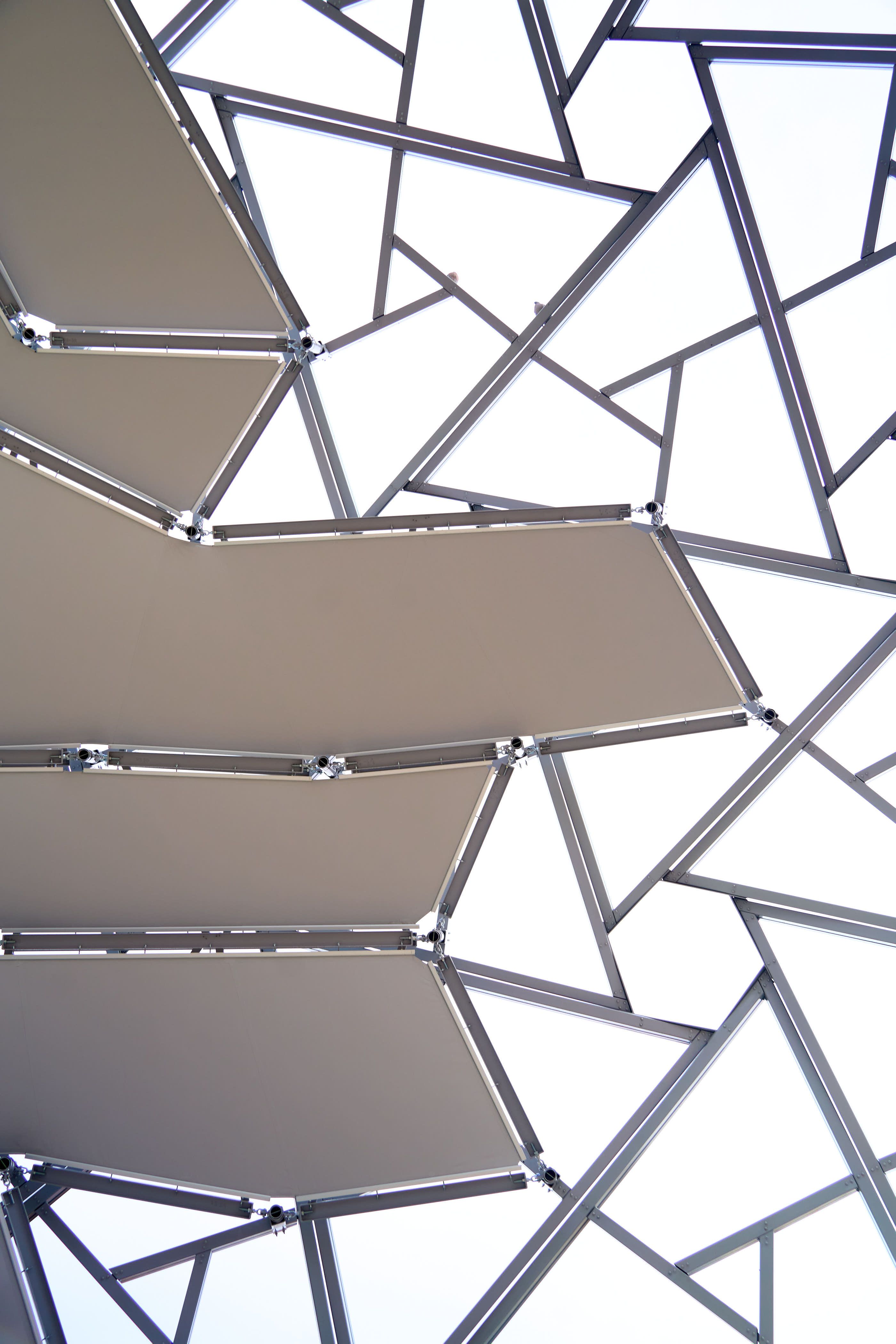 Artistic shot of a modern geometric metal structure against the sky in Valladolid, Spain.